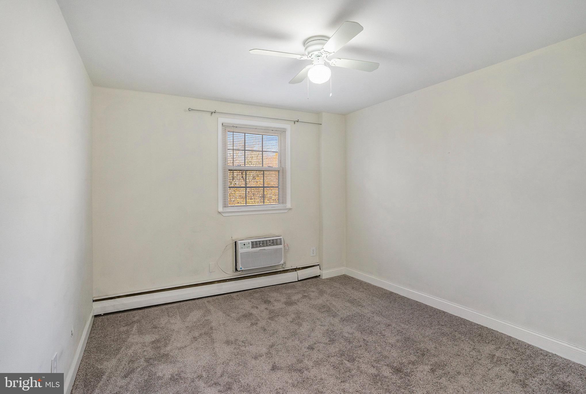 207 Walnut Hill Road, Unit B4 West Chester, PA 19382 - Photo 22 of 35 an empty room with windows and fan