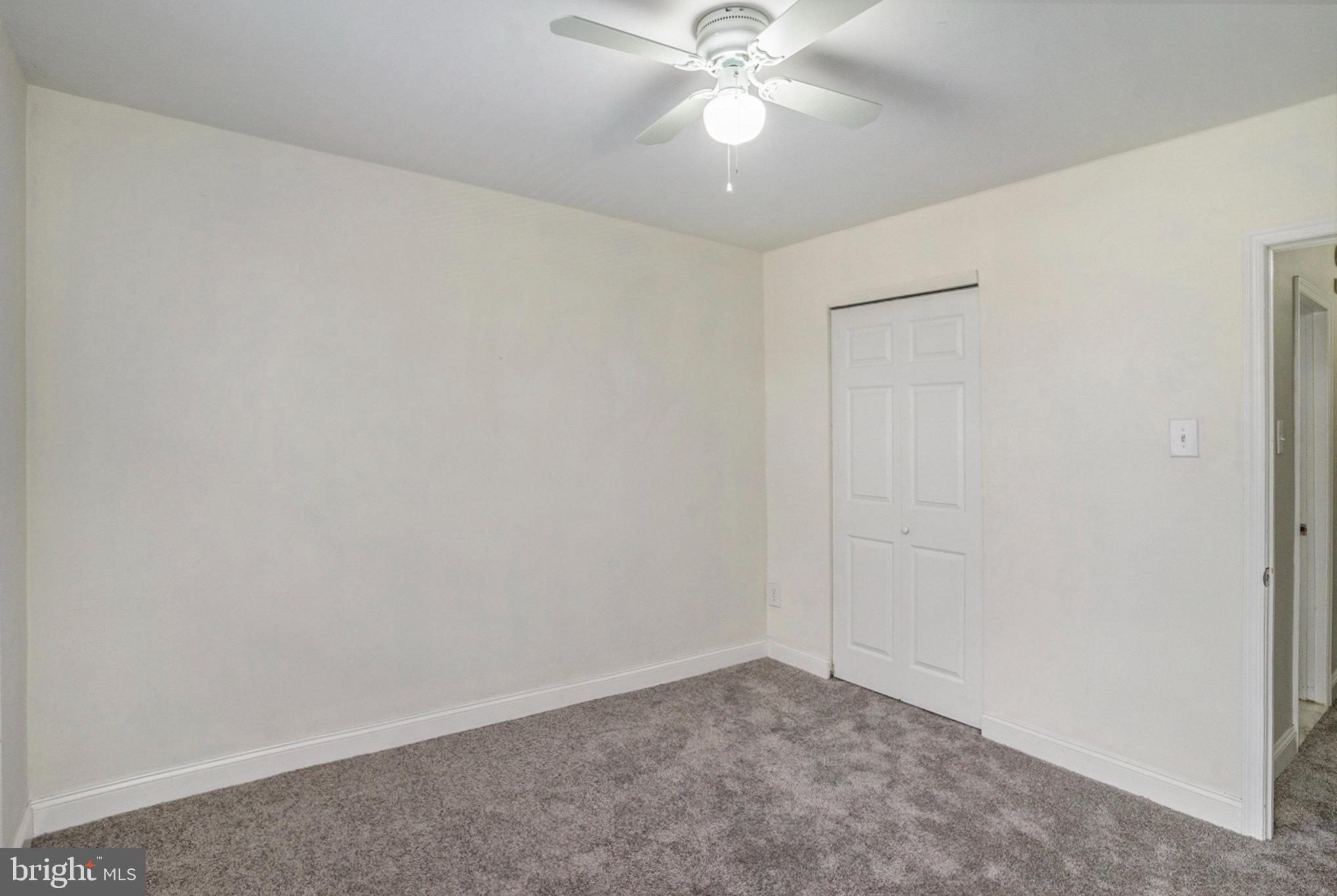 207 Walnut Hill Road, Unit B4 West Chester, PA 19382 - Photo 23 of 35 an empty room with a fan and a fan