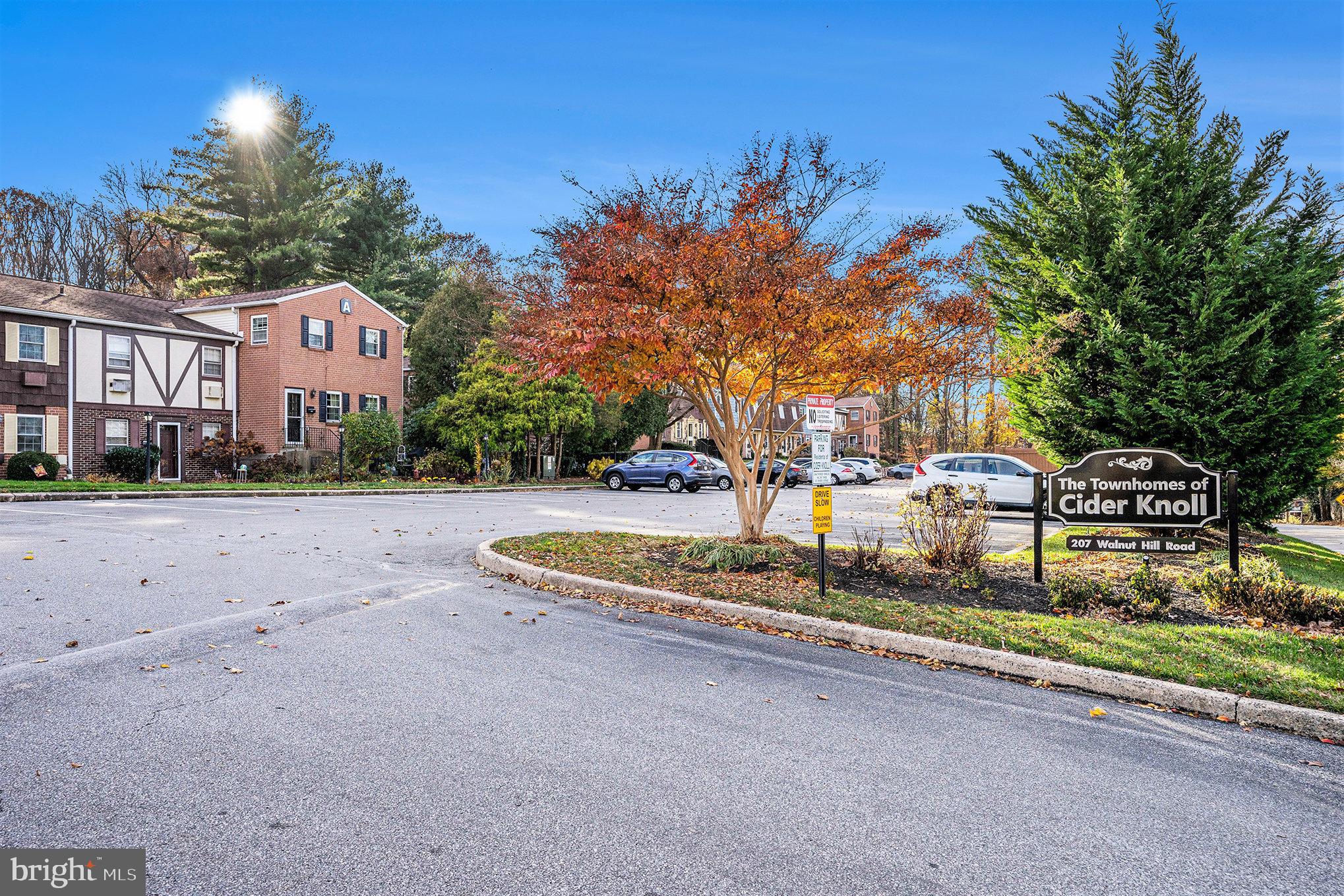 207 Walnut Hill Road, Unit B4 West Chester, PA 19382 - Photo 28 of 35 a sign board with buildings in the background