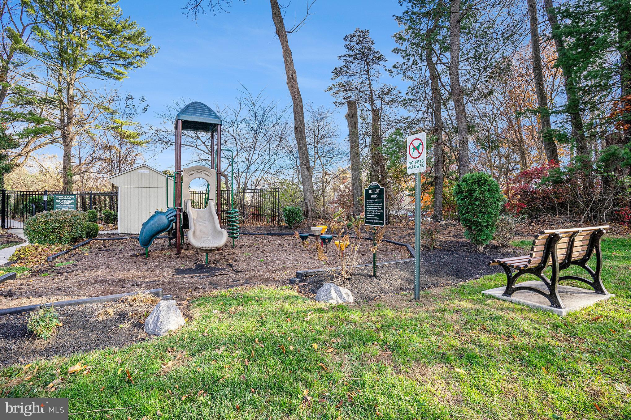 207 Walnut Hill Road, Unit B4 West Chester, PA 19382 - Photo 30 of 35 a front view of a house with a yard fountain and outdoor seating