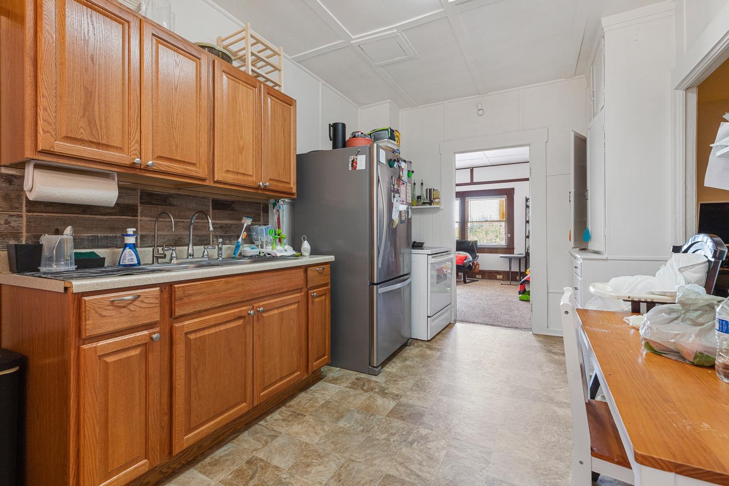 3724 Lockwood Road Ceres, CA 95307 - Photo 13 of 18 a kitchen with refrigerator and cabinets