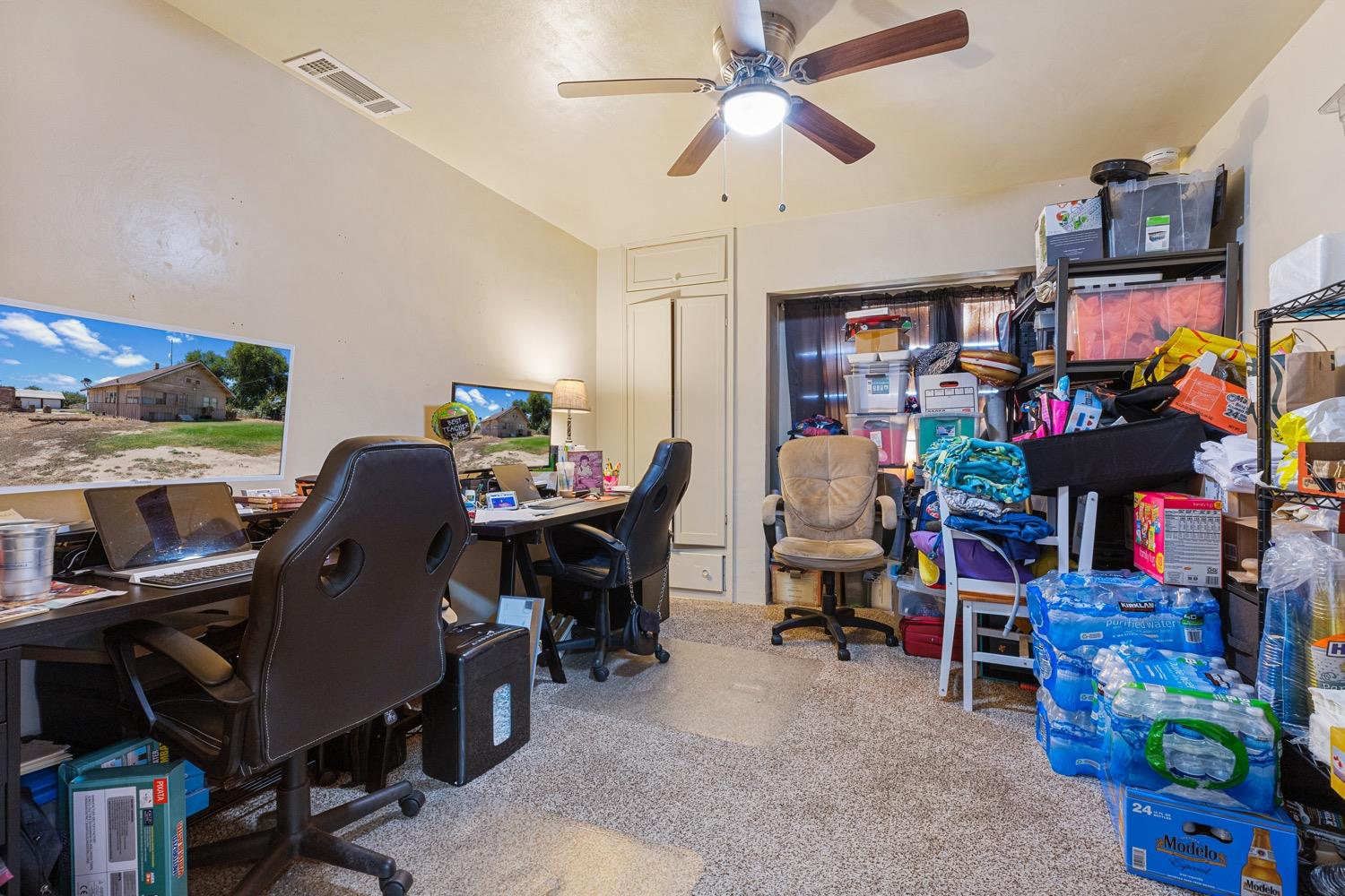 3724 Lockwood Road Ceres, CA 95307 - Photo 16 of 18 a view of a workspace with furniture and a livingroom