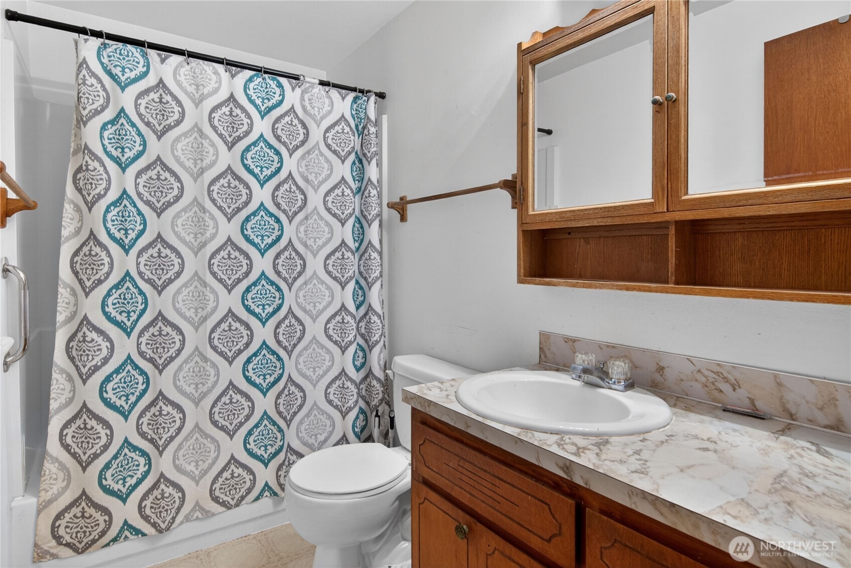716 Murphy Way Sultan, WA 98294 - Photo 22 of 31 a bathroom with a granite countertop sink and a mirror