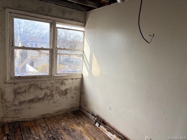 114-06 167th Street Queens, NY 11434 - Photo 11 of 23 Unfurnished room featuring dark wood-style floors