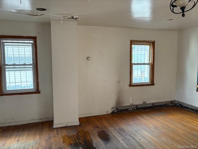 114-06 167th Street Queens, NY 11434 - Photo 20 of 23 Spare room featuring hardwood / wood-style floors and plenty of natural light