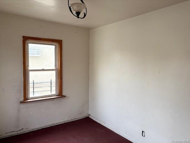 114-06 167th Street Queens, NY 11434 - Photo 7 of 23 Spare room with dark colored carpet