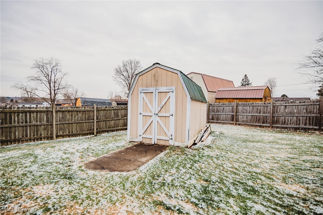 91 Mike Street Washington, WV 26181 - Photo 37 of 42 View of shed with a fenced backyard