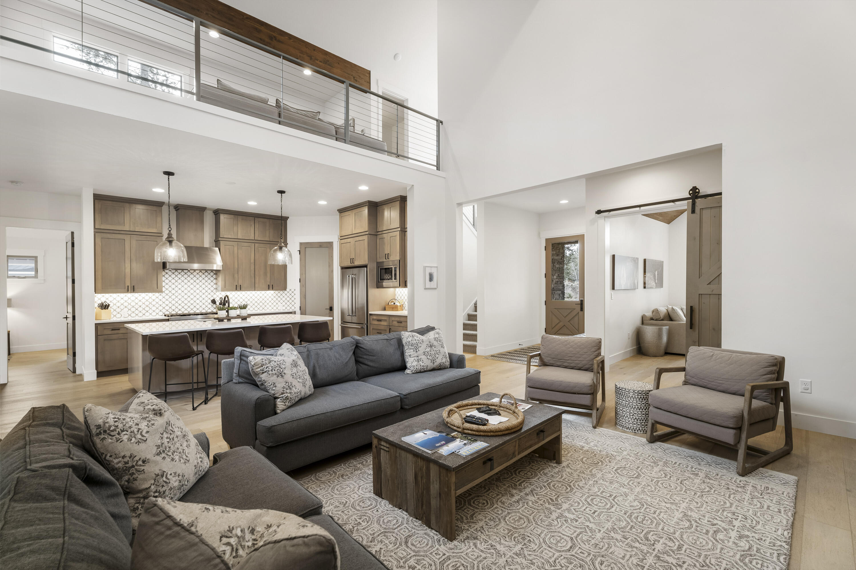 56302 Sable Rock Loop, Unit 255 Bend, OR 97707 - Photo 12 of 65 a living room with furniture and view of kitchen