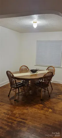a bathroom with a sink a toilet and shower curtain