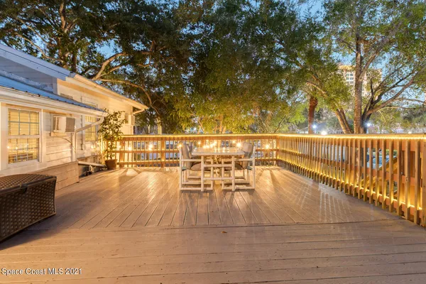 a view of a swimming pool with an outdoor seating