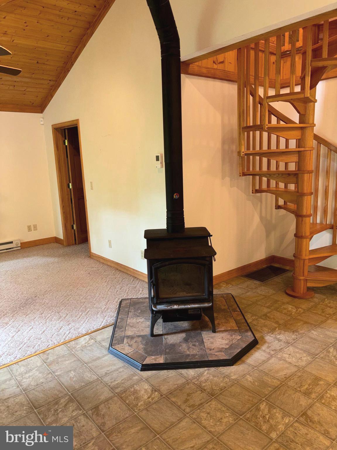 251 Riffey Mountain Lane Mathias, WV 26812 - Photo 6 of 33 Great room showing staircase to upper level