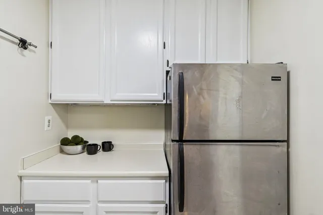 a bedroom with a large bed and a large window