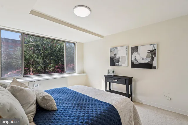 a bedroom with a bed and a walk in closet