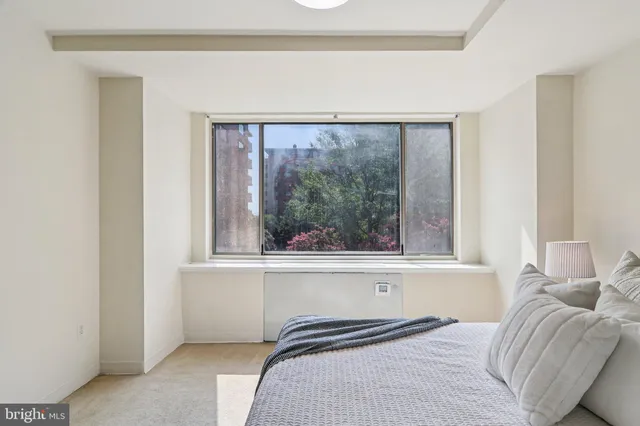 a view of a balcony with table and chairs