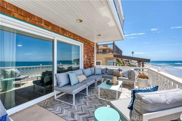 a outdoor space with patio the couches and pool table with chairs