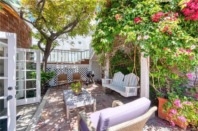 a view of a chairs and table in a backyard