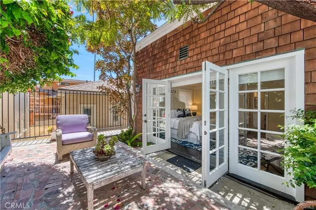 a view of a chair and table in the patio