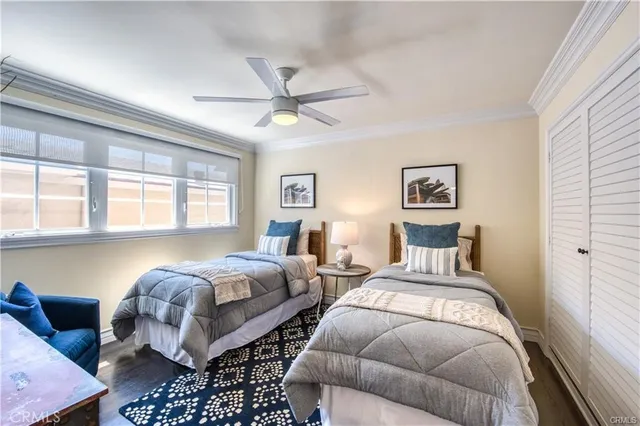 a bedroom with bed and a window