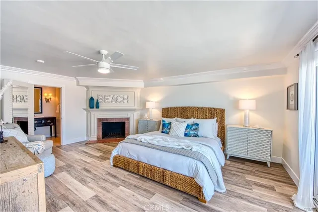 a bedroom with a bed and a fireplace