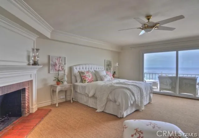 a bedroom with a bed and a fireplace