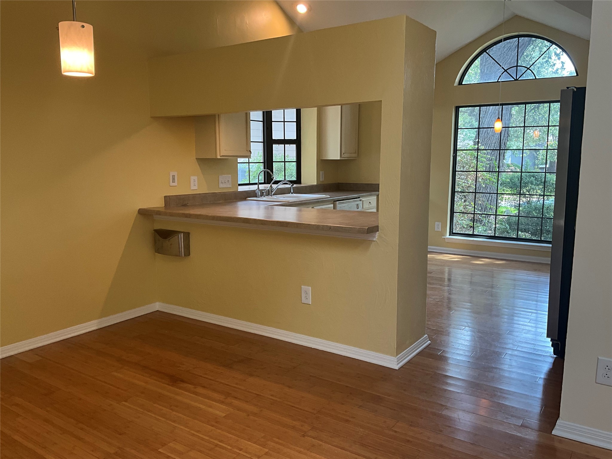 15702 Racine Cove Austin, TX 78717 - Photo 8 of 27 Sun-filled spaces abound with soaring vaulted ceilings and rich wood flooring.