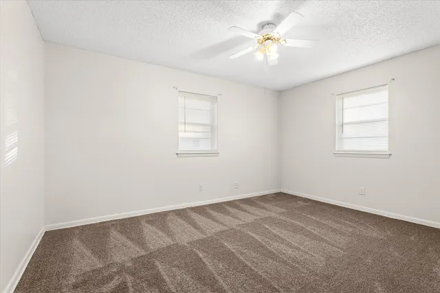 a bathroom with a sink toilet and vanity