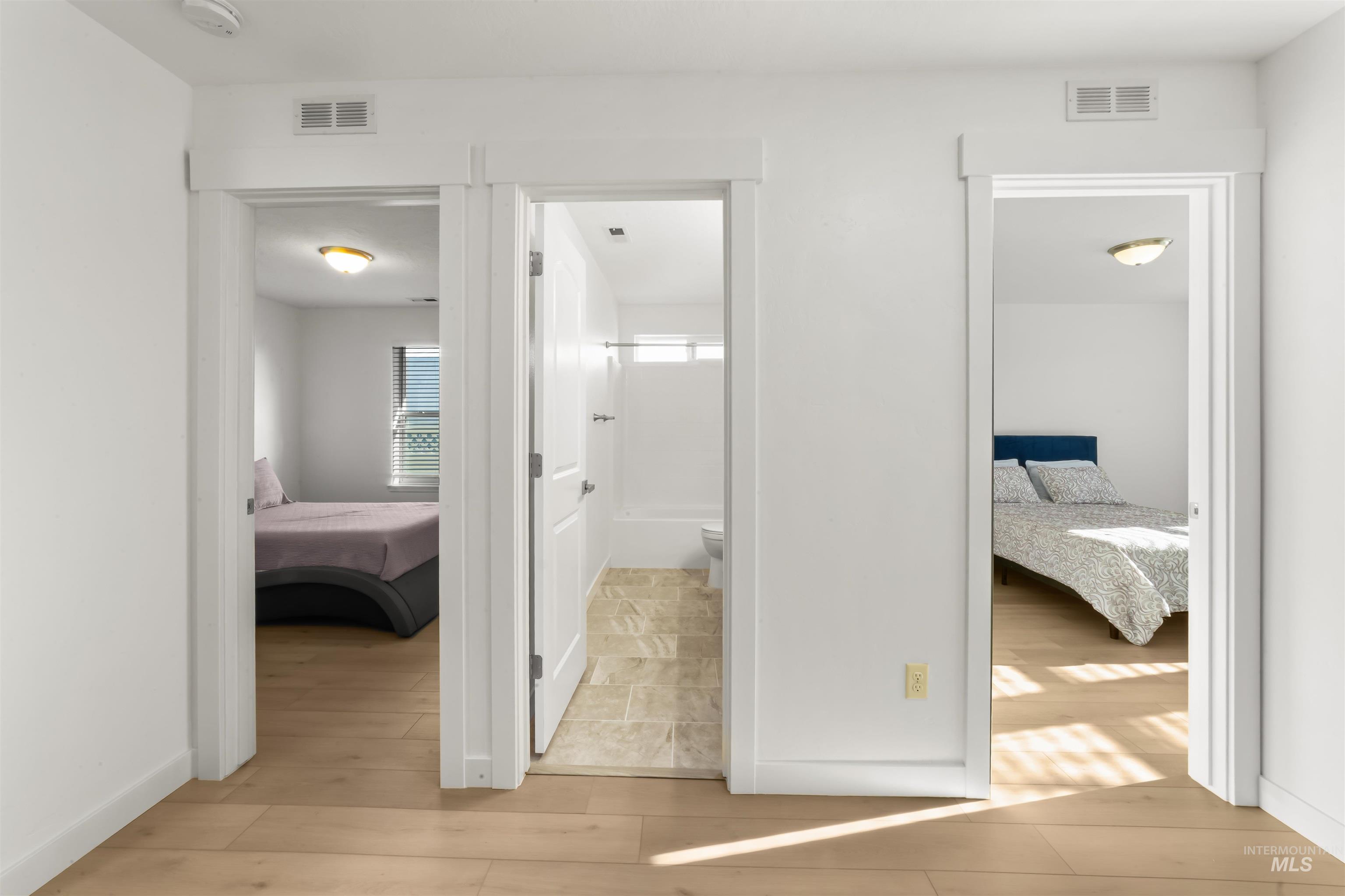 548 North Ripplerock Place Star, ID 83669 - Photo 16 of 42 Hallway with light wood-style floors and baseboards