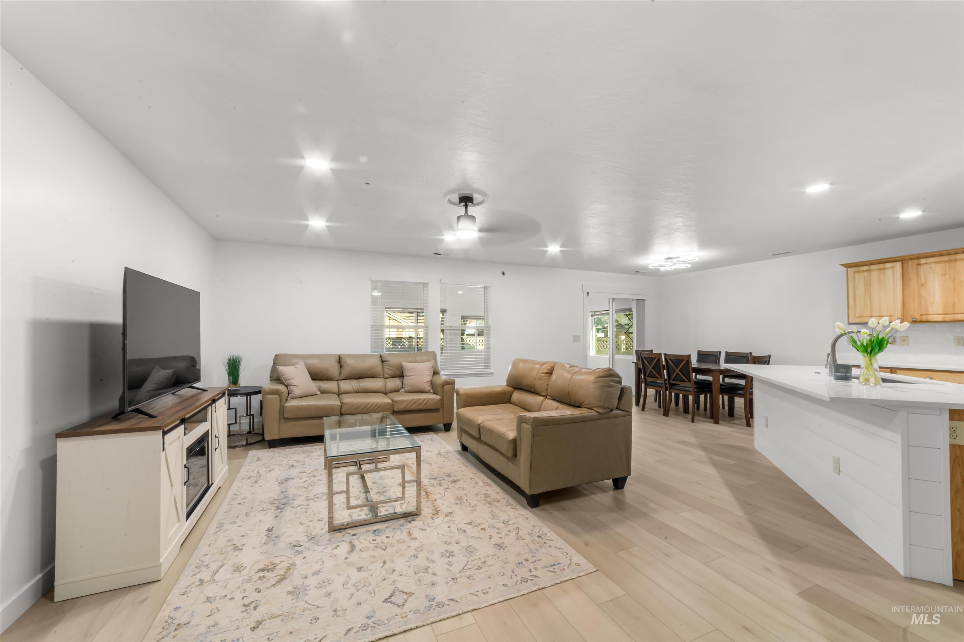 548 North Ripplerock Place Star, ID 83669 - Photo 22 of 42 Living room with light wood-style floors and a ceiling fan