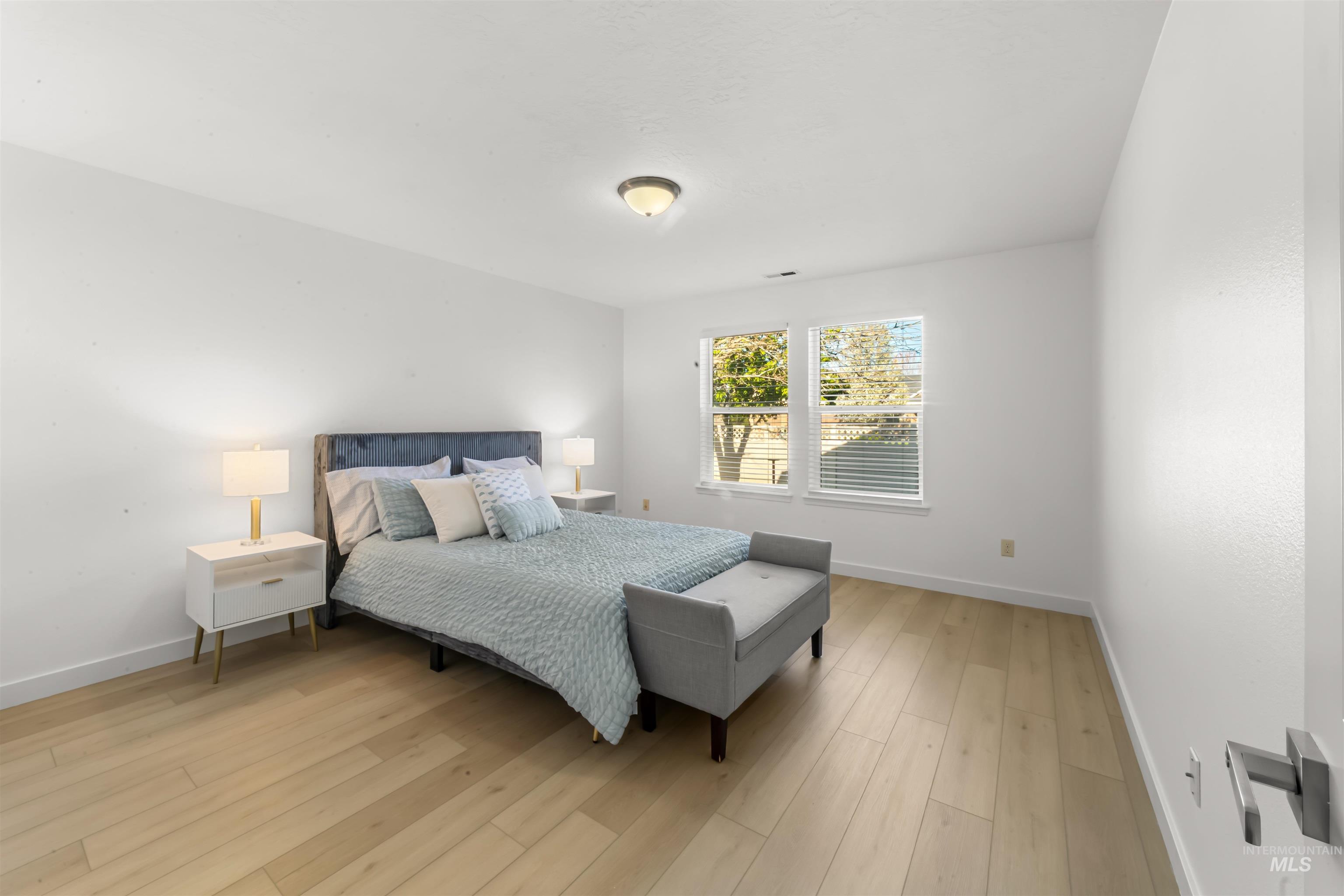 548 North Ripplerock Place Star, ID 83669 - Photo 26 of 42 Bedroom with baseboards and light wood-style flooring