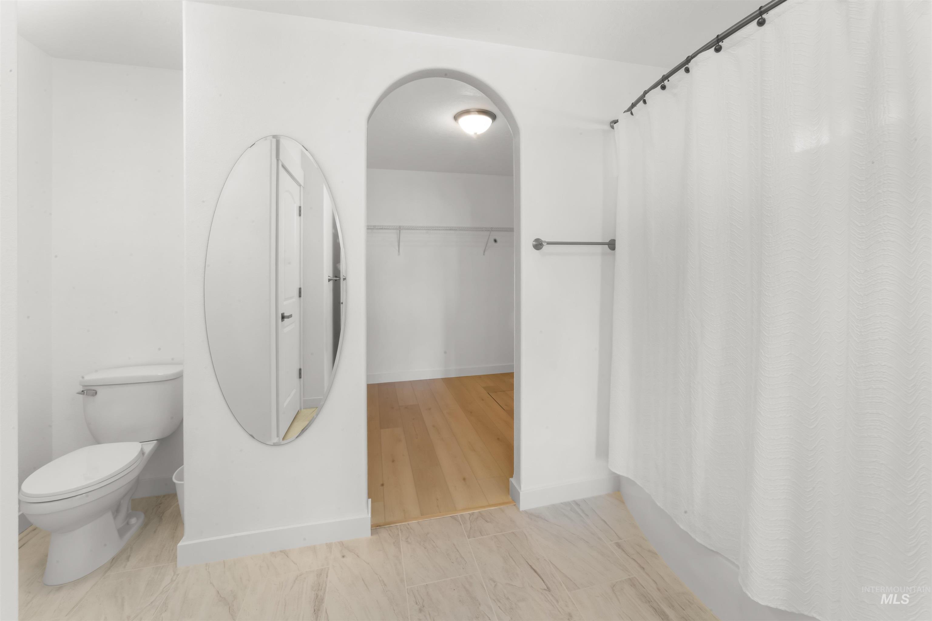 548 North Ripplerock Place Star, ID 83669 - Photo 30 of 42 Full bath with a shower with shower curtain and a walk in closet