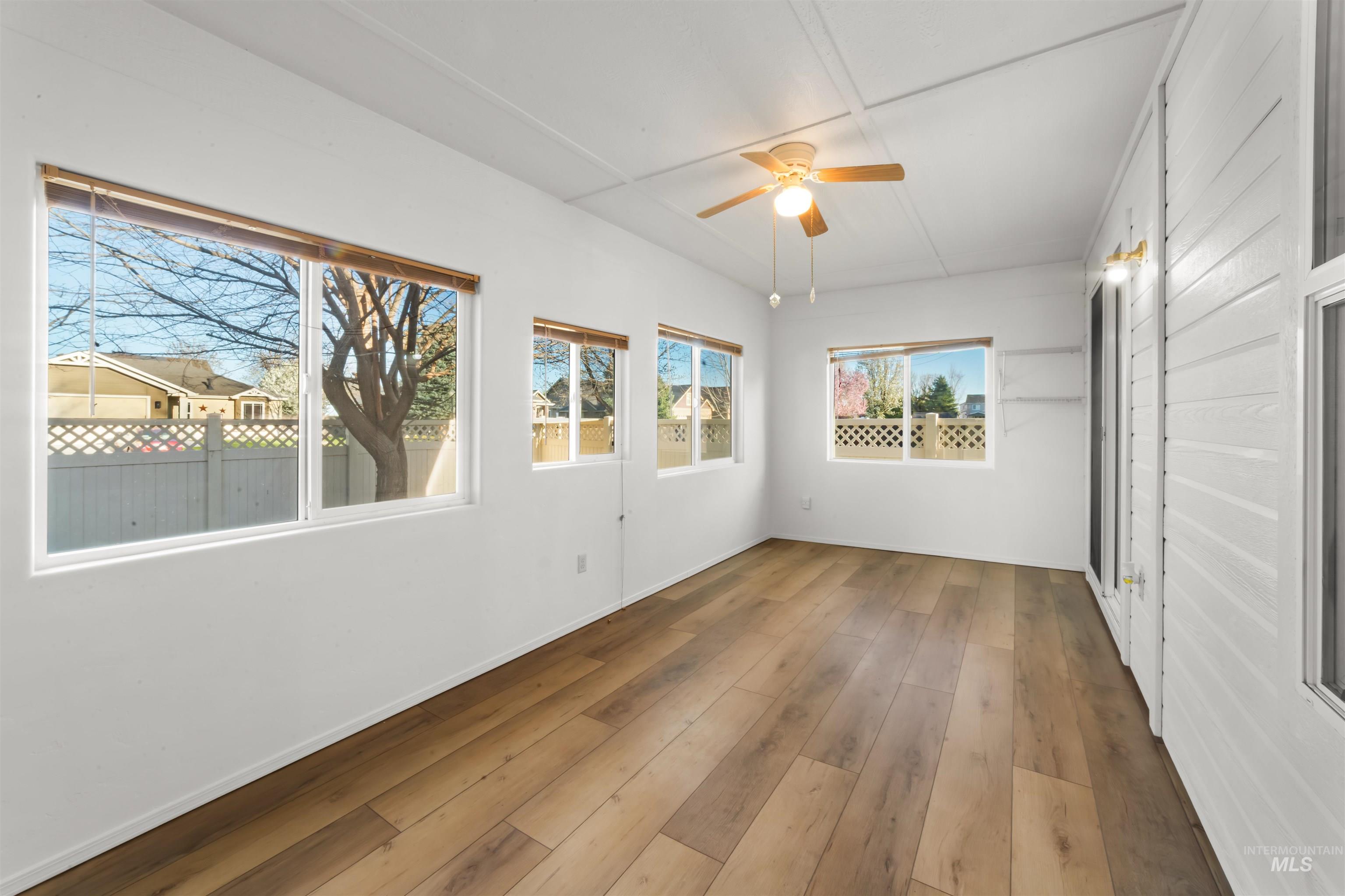 548 North Ripplerock Place Star, ID 83669 - Photo 36 of 42 Unfurnished sunroom featuring a ceiling fan