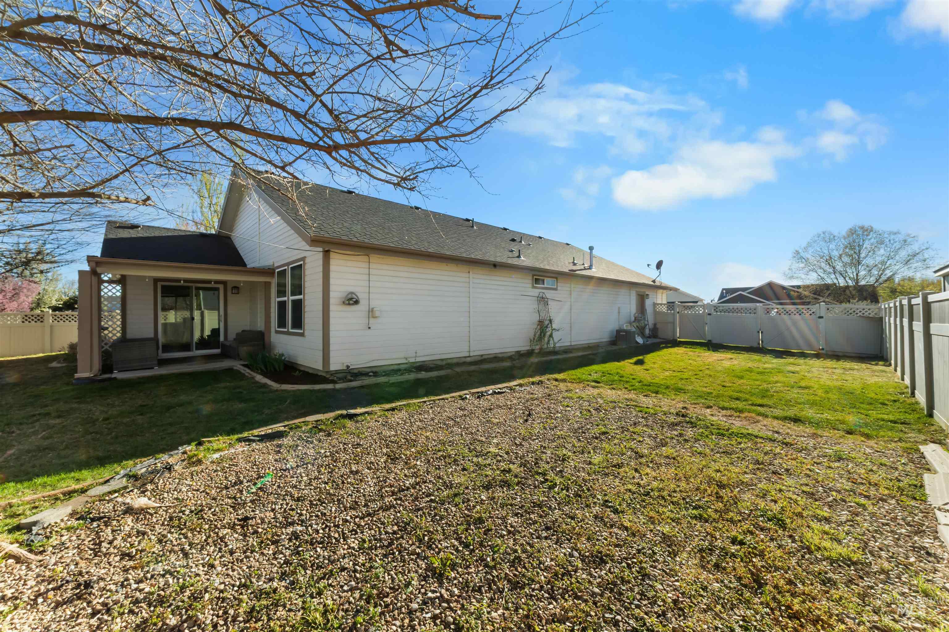 548 North Ripplerock Place Star, ID 83669 - Photo 5 of 42 Rear view of property with a fenced backyard and a patio area