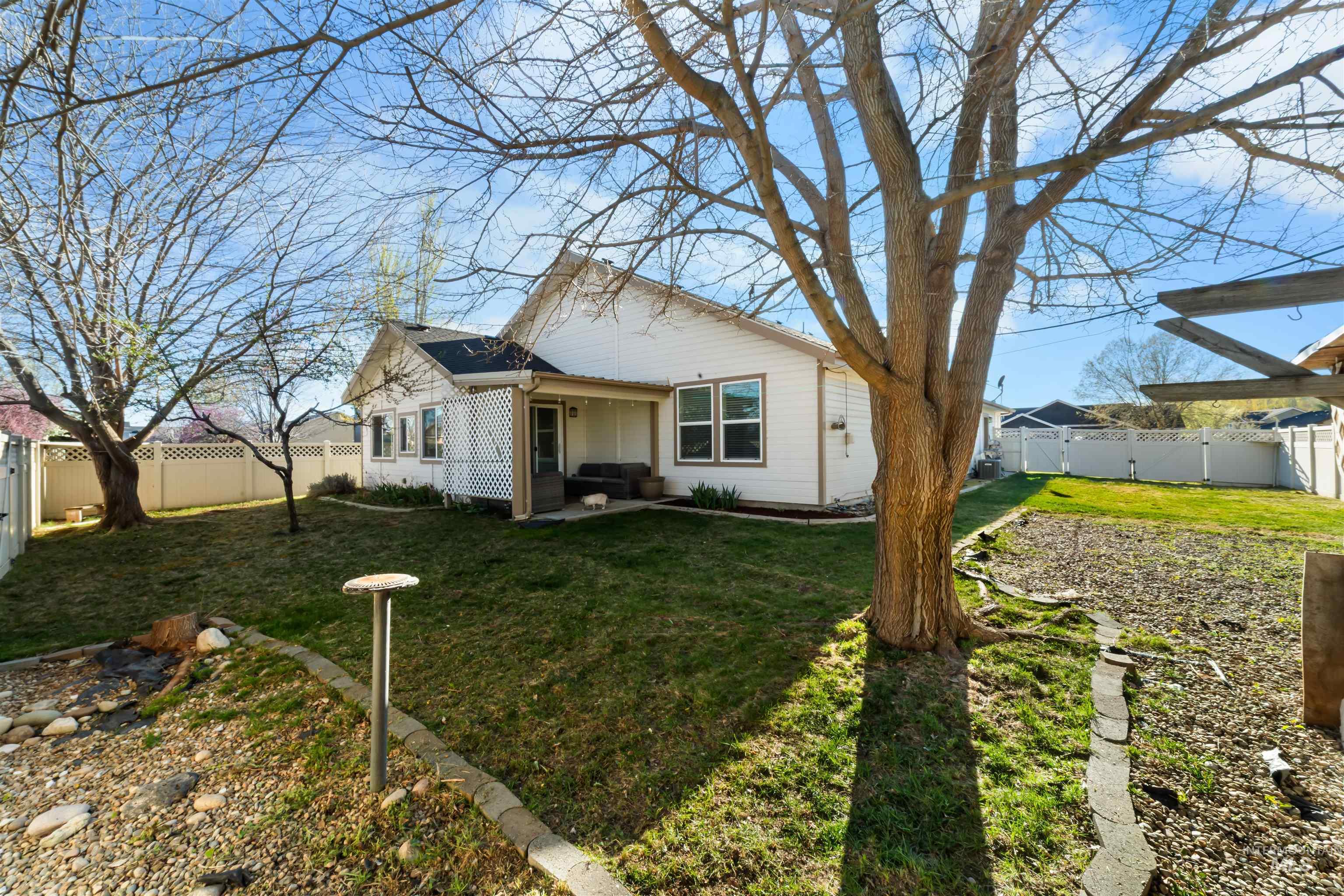 548 North Ripplerock Place Star, ID 83669 - Photo 6 of 42 View of front of home with a fenced backyard and a patio area