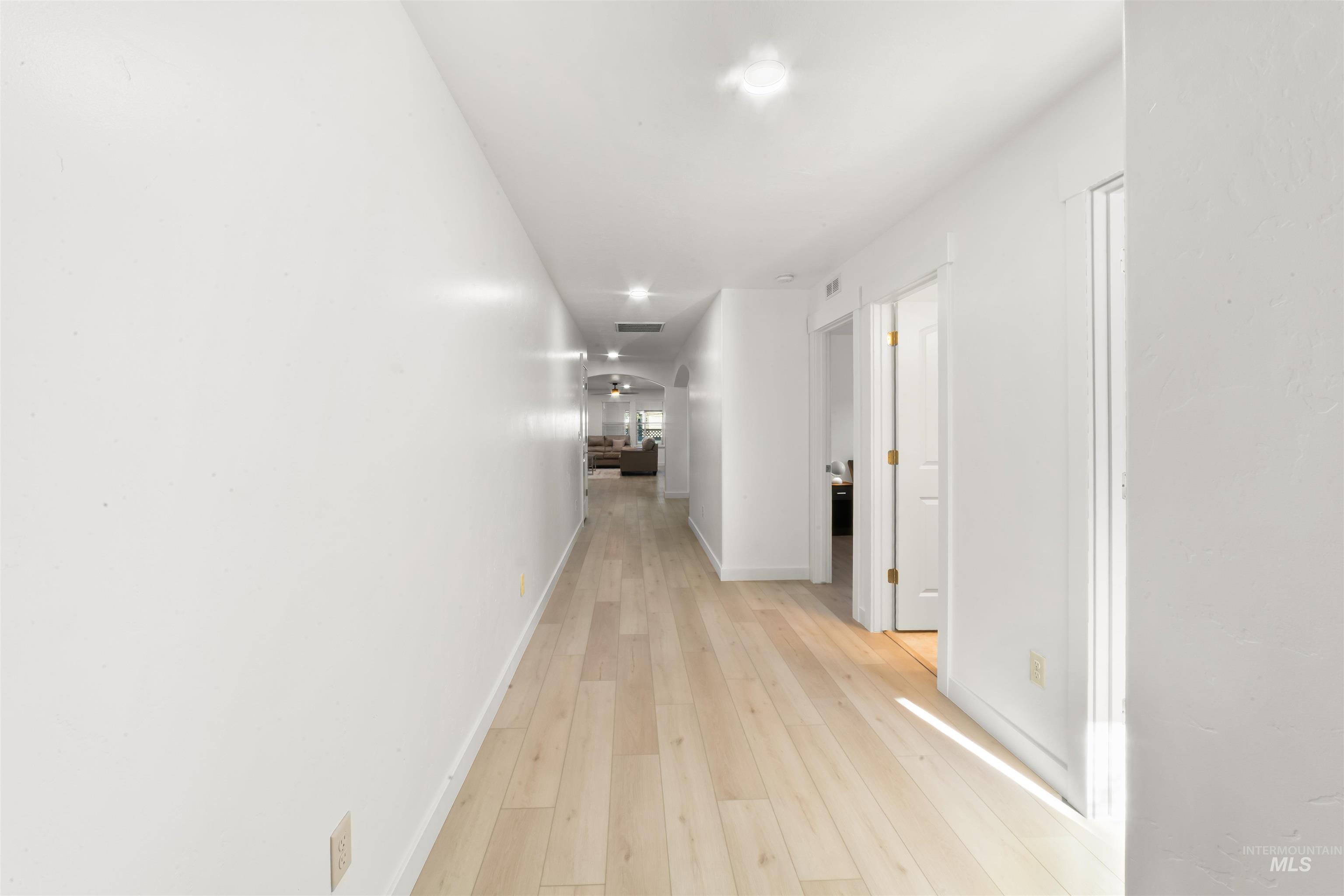 548 North Ripplerock Place Star, ID 83669 - Photo 9 of 42 Hallway with light wood finished floors and baseboards