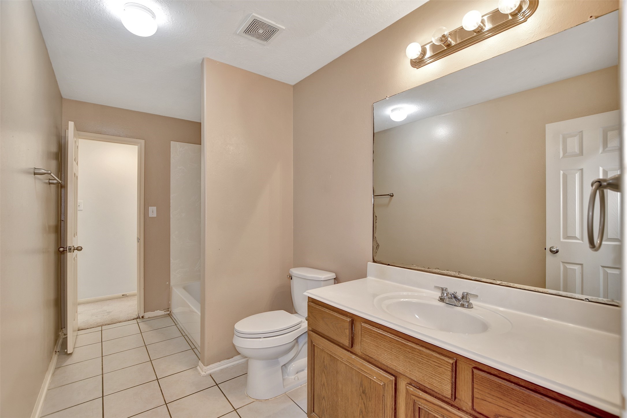 5918 Durango Mist Lane Katy, TX 77449 - Photo 21 of 41 a bathroom with a sink a toilet and a mirror