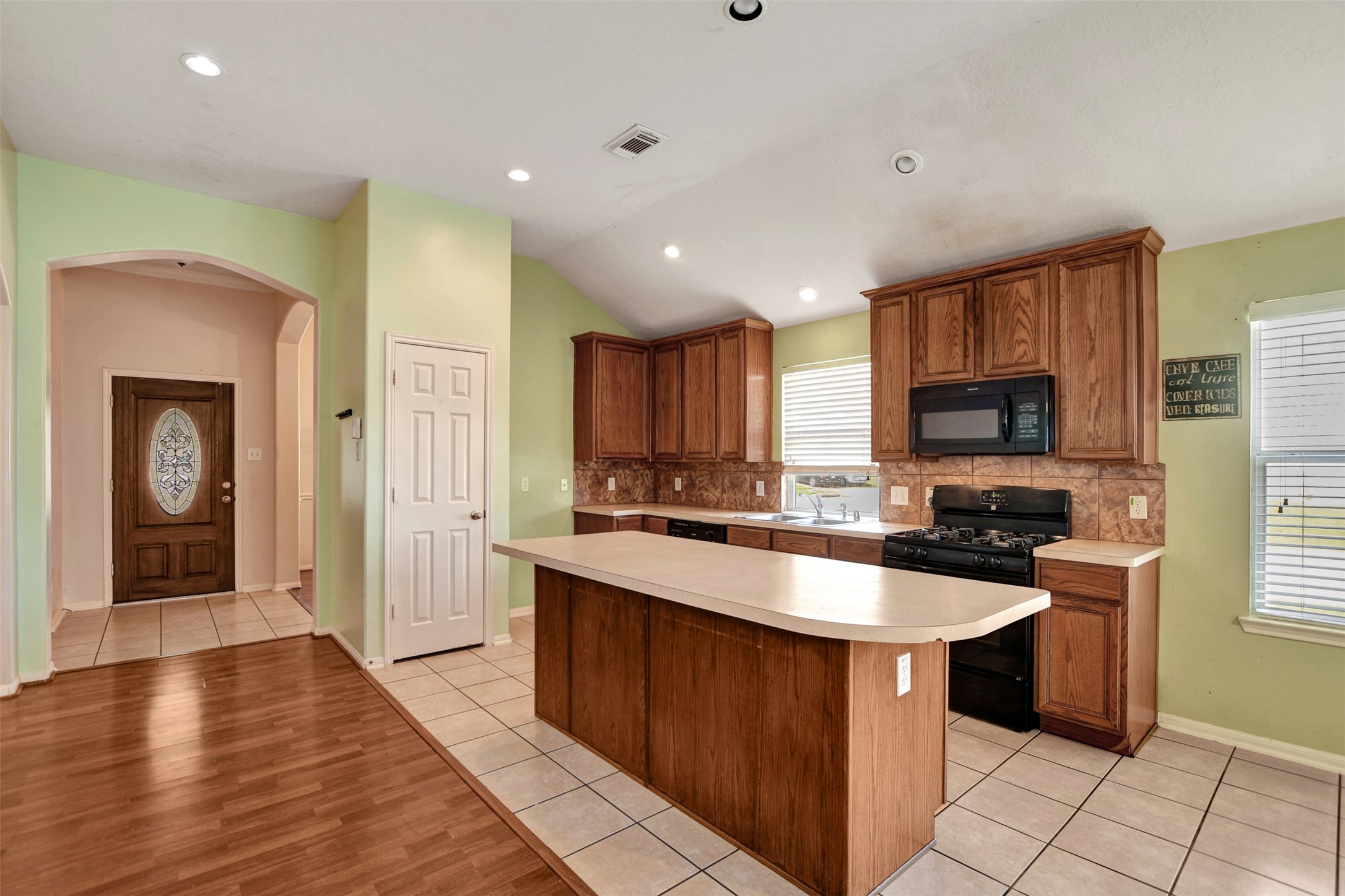 5918 Durango Mist Lane Katy, TX 77449 - Photo 22 of 41 a kitchen with stainless steel appliances granite countertop a sink counter space cabinets and a window