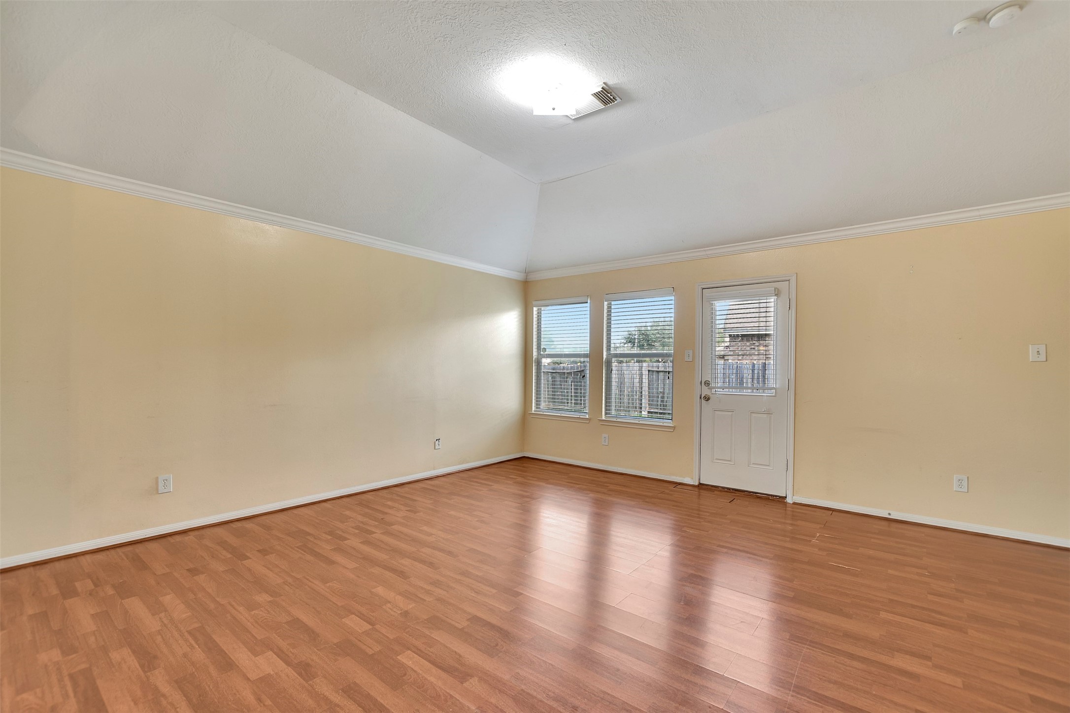 5918 Durango Mist Lane Katy, TX 77449 - Photo 28 of 41 a view of an empty room with wooden floor and a window