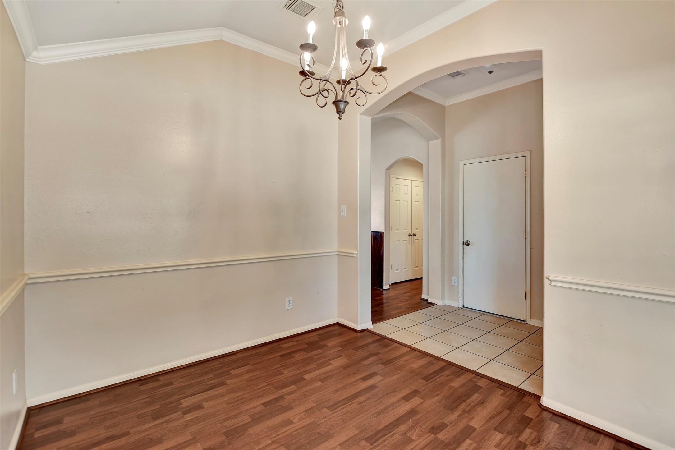 5918 Durango Mist Lane Katy, TX 77449 - Photo 30 of 41 a view of a big room with wooden floor and a chandelier