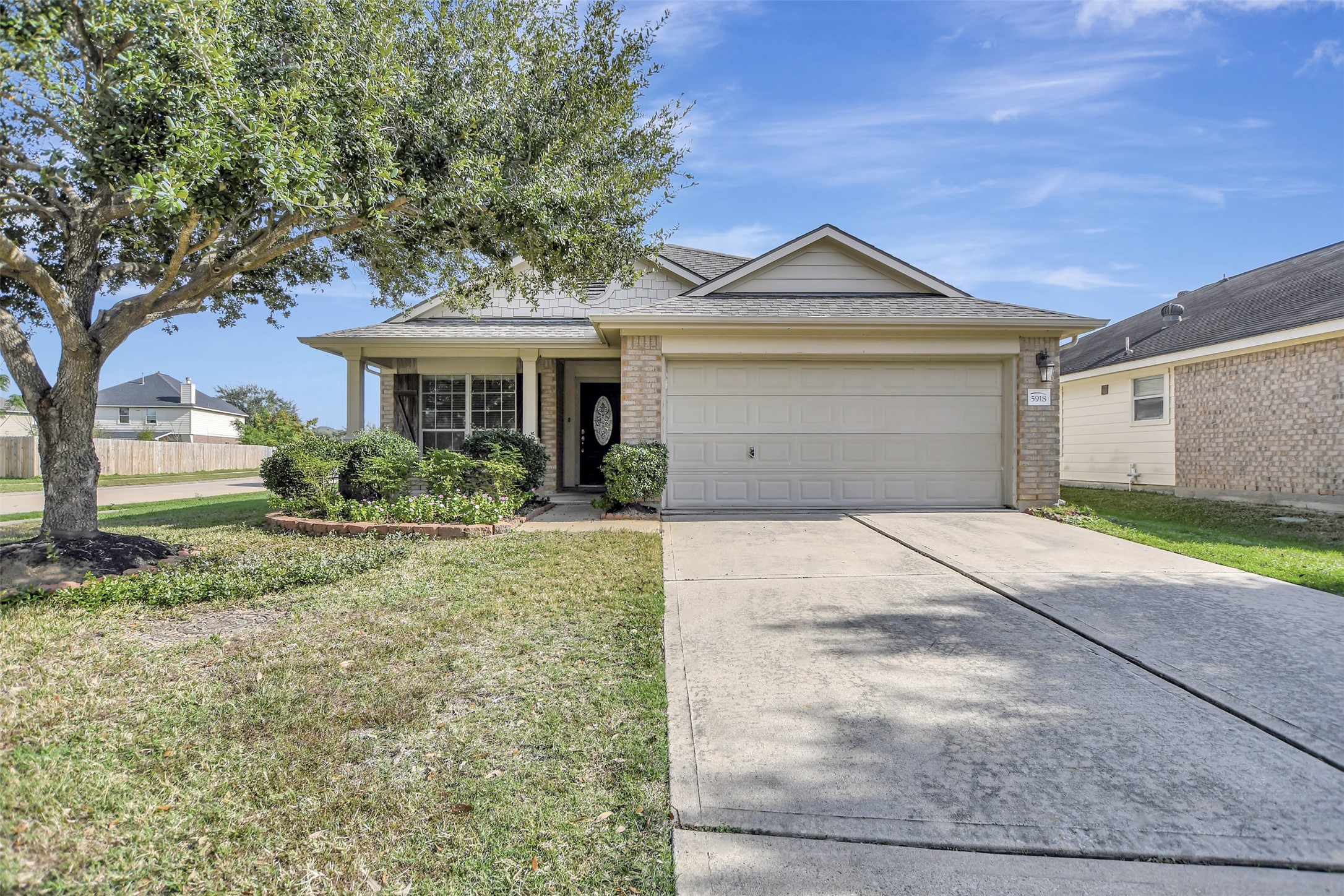 5918 Durango Mist Lane Katy, TX 77449 - Photo 4 of 41 a front view of a house with garden