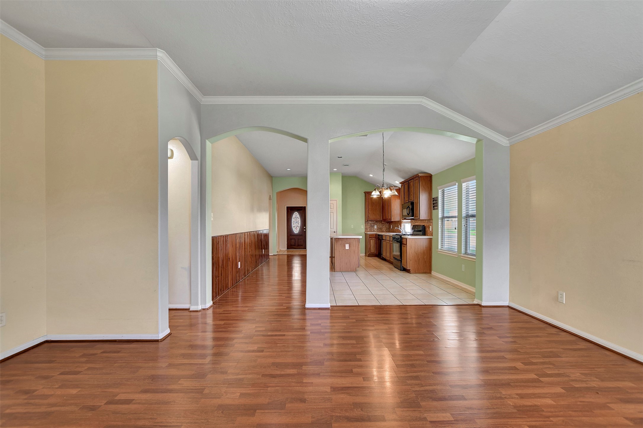 5918 Durango Mist Lane Katy, TX 77449 - Photo 5 of 41 a view of a living room and dining room with wooden floor