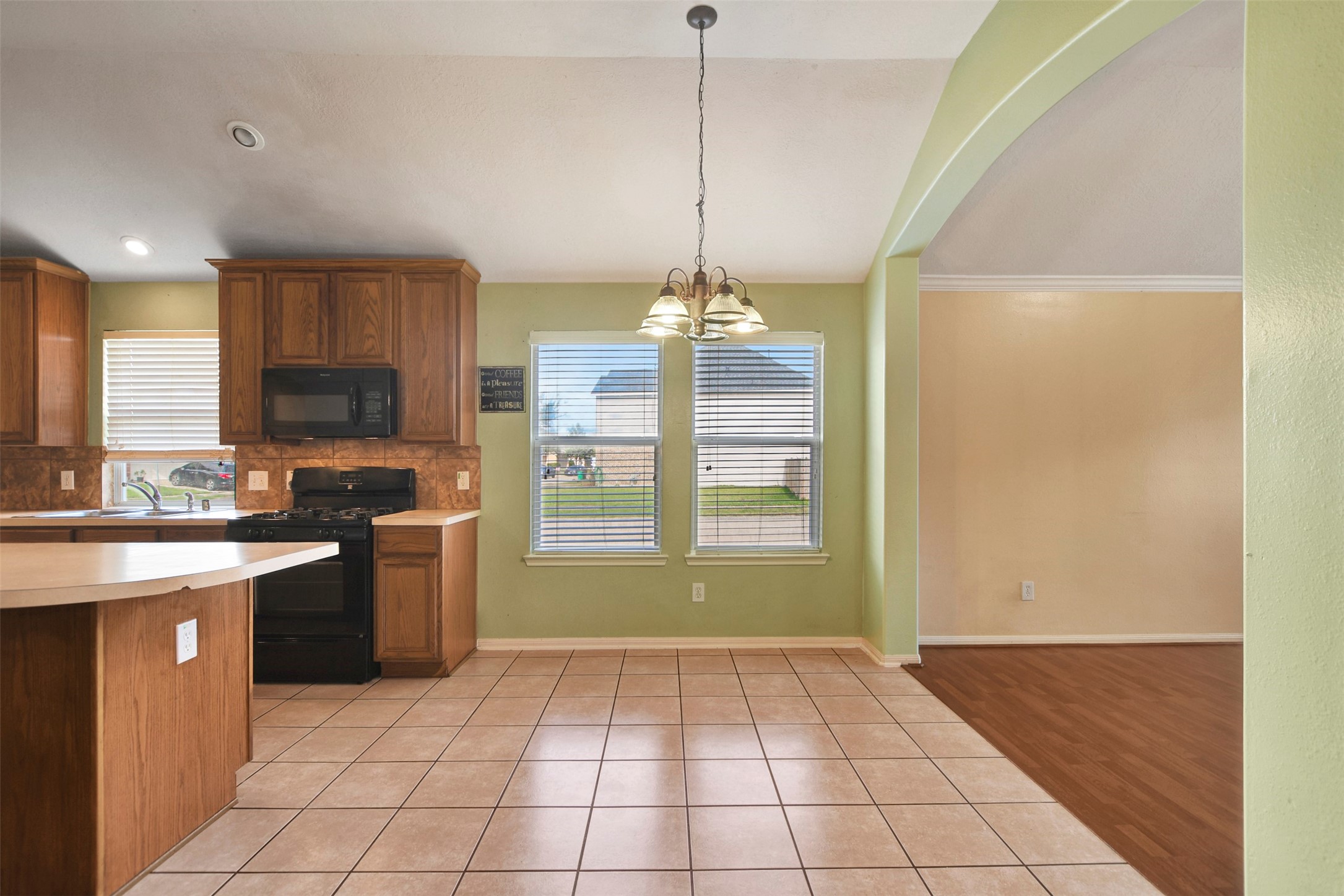 5918 Durango Mist Lane Katy, TX 77449 - Photo 8 of 41 a view of a kitchen with a sink and microwave
