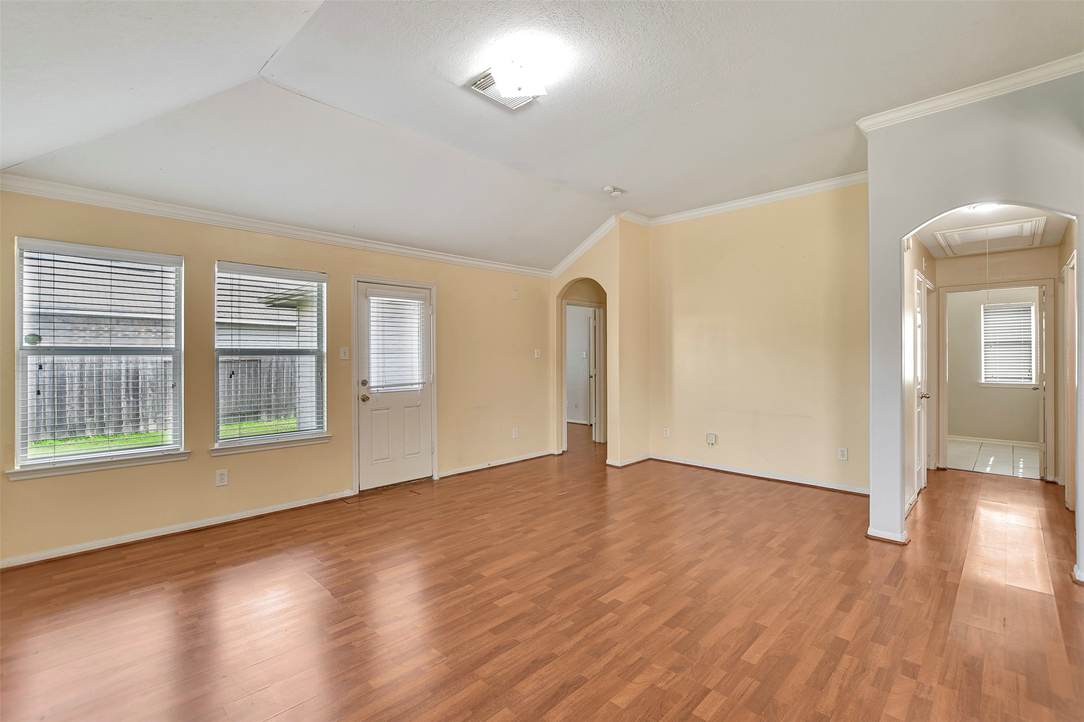 5918 Durango Mist Lane Katy, TX 77449 - Photo 10 of 41 a view of an empty room with wooden floor and a window