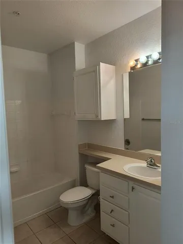 a bathroom with a shower and a toilet