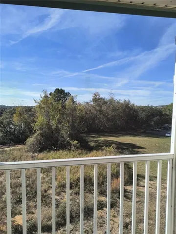a view of a balcony with an outdoor space