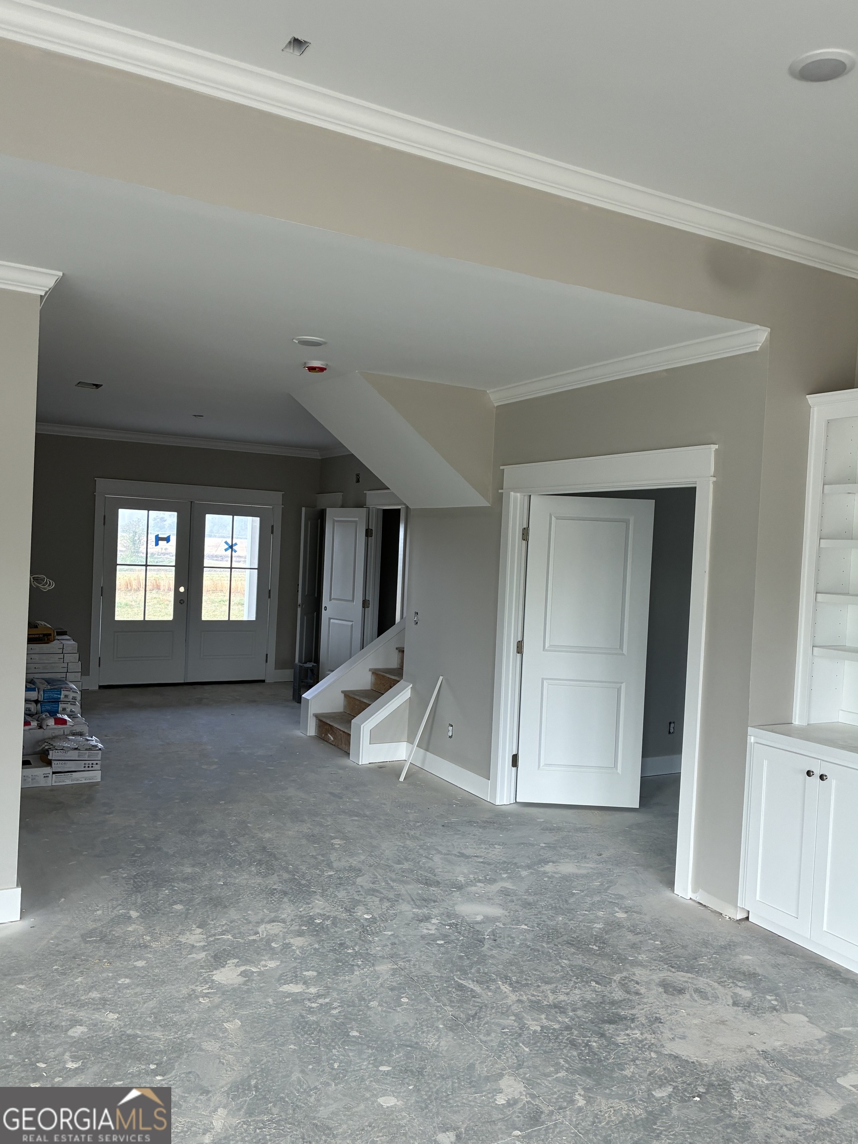 3167 Jason Franklin Road Register, GA 30452 - Photo 5 of 6 an empty room with a fireplace and windows