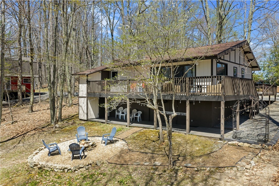811 Pine Ridge Road Beech Mountain, NC 28604 - Photo 22 of 26 a house with trees in front of it