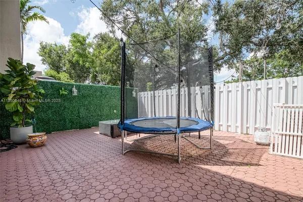 a bench sitting in the middle of a yard