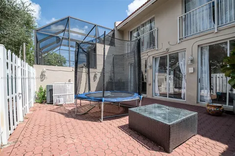 a view of a house with backyard and porch