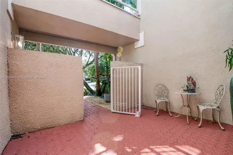 a view of backyard with seating space