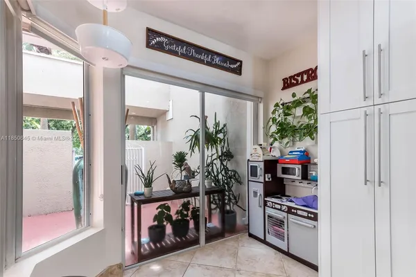 a room with furniture and a potted plant
